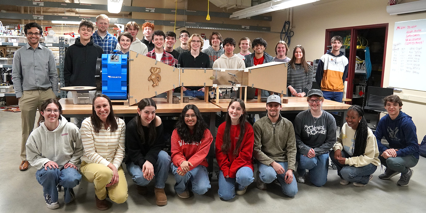 Students taking a picture with a project