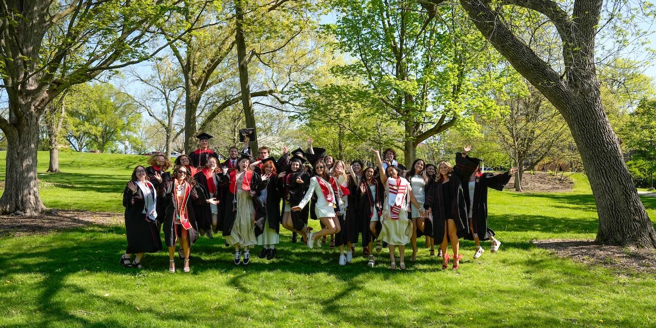 Graduating students jump in joy