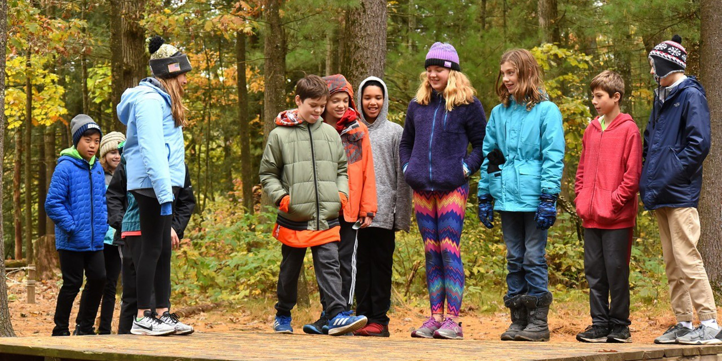 Kids playing outside in the woods