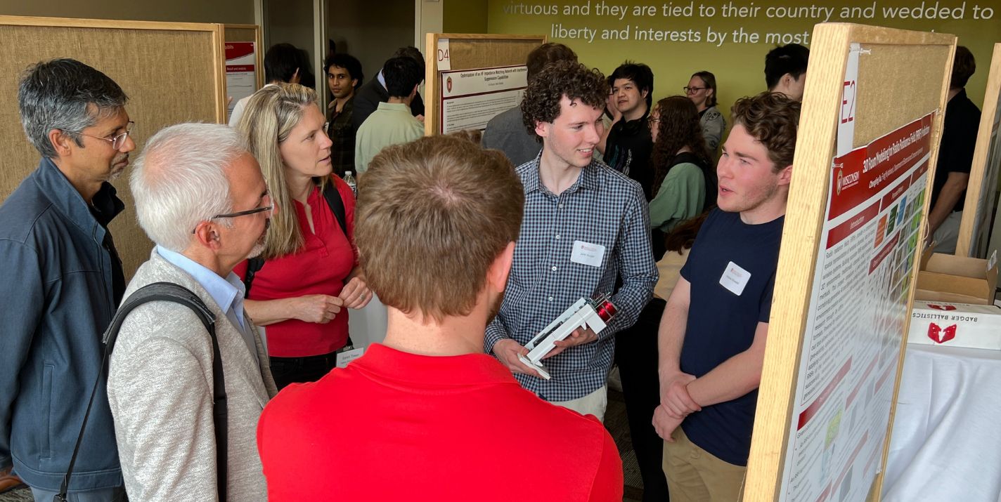Students shown presenting their research projects