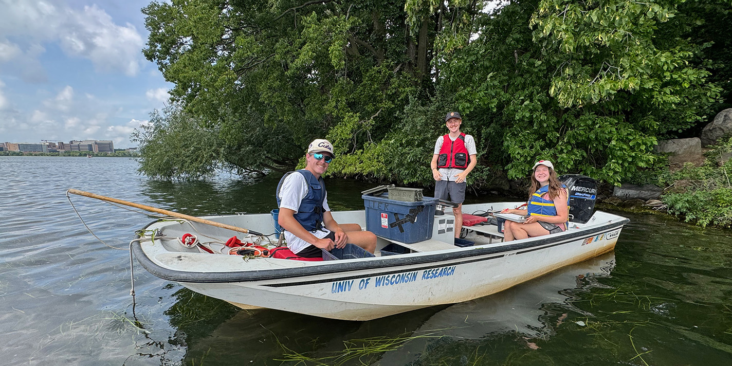Research team is shown on their boat