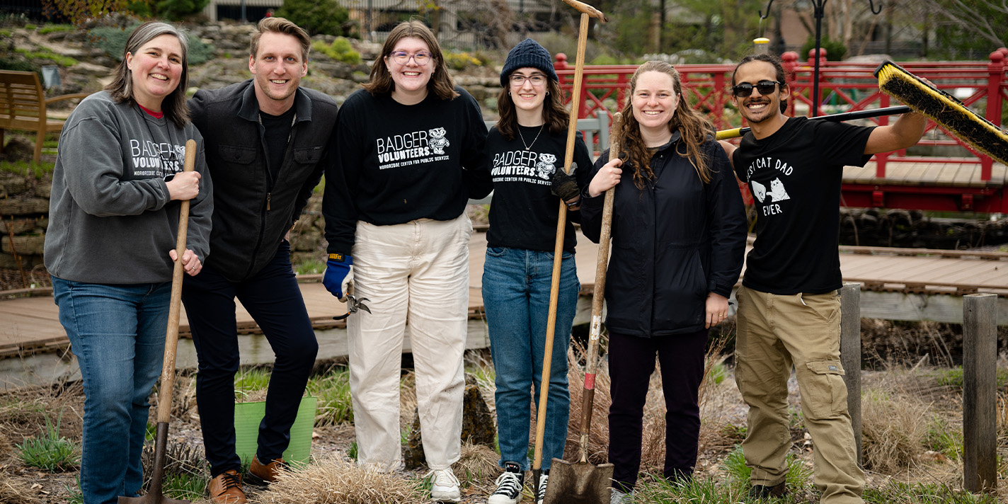 Students pose for a picture during a clean-up event