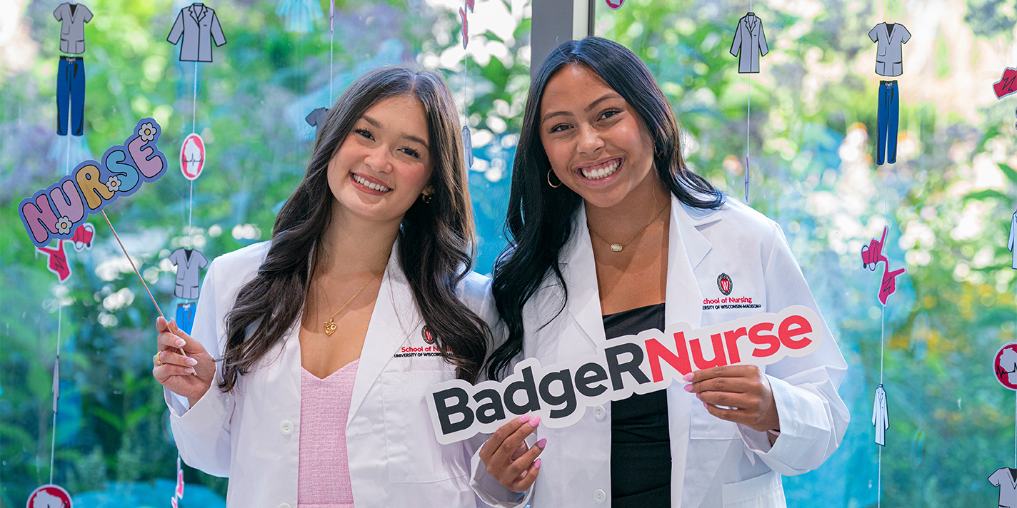 Two badger nurses shown with their white coats