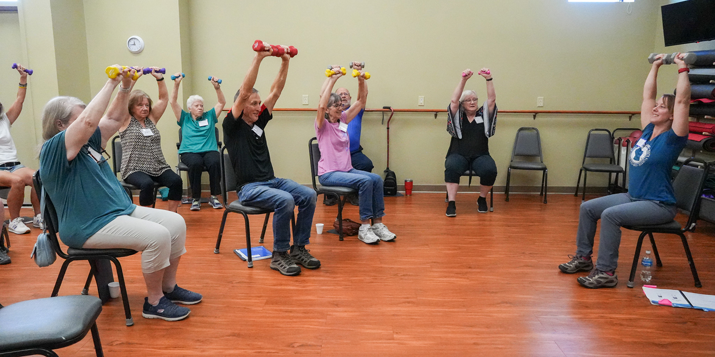 Senior adults shown participating in an exercise class
